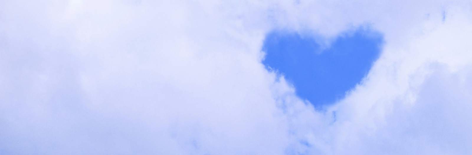 heart shaped break in the clouds