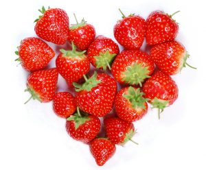 ripe strawberries in a heart shape